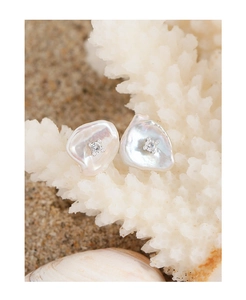 Baroque pearl earrings featuring a center zircon stone on a white coral branch