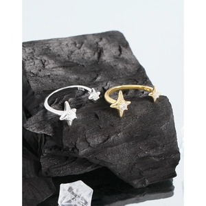 Minimalist S925 sterling silver starburst zircon ring set on a black charcoal base