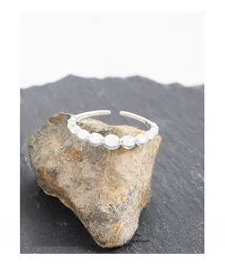 Macro shot of S925 sterling silver ring showing gradient beads and 925 hallmark stamp