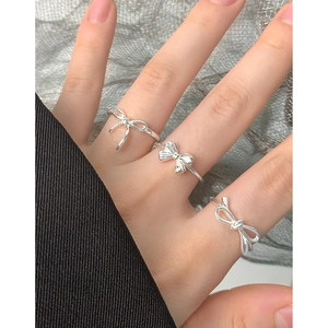Three-piece S925 sterling silver bow rings set in polished silver for elegant layering