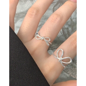 Elegant S925 sterling silver hollow bow ring set with minimalist polished finish