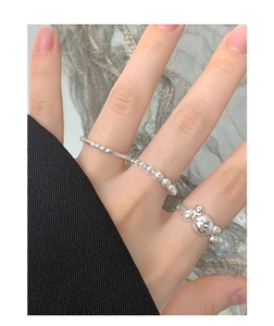 Detailed view of S925 sterling silver beaded rings in minimalist ball design for women