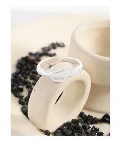 Macro detail of polished S925 sterling silver ring with irregular lava stone design