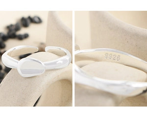 Close-up of S925 sterling silver hallmark on irregular lava style stacking ring
