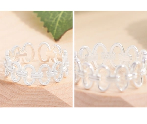 Macro detail of S925 sterling silver interlocking rings showing authentic hallmark stamp