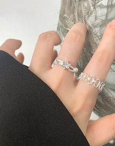 Detail of S925 sterling silver interlocking rings with cz stone on model hand