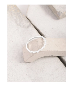 Macro shot of S925 sterling silver beaded ring showing the inner material hallmark