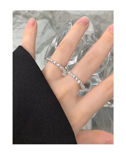 Close-up of S925 sterling silver beaded ring featuring polished spheres on finger