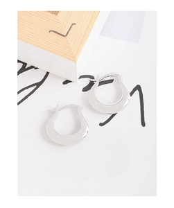 Detailed close-up of S925 hallmark on minimalist irregular U-shape silver hoop earrings