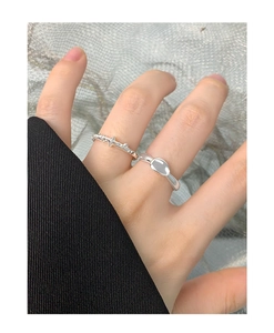 Macro detail of S925 sterling silver lava rings with star relief and smooth oval design