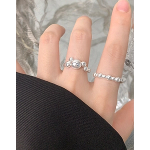 Polished S925 sterling silver ring set with varied bead sizing for a minimalist woman's look
