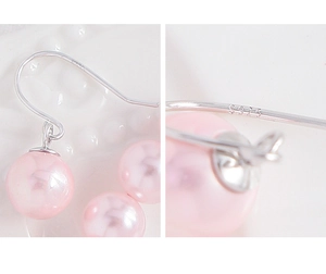Detailed view of S925 sterling silver hallmark on elegant pink pearl drop earring hook