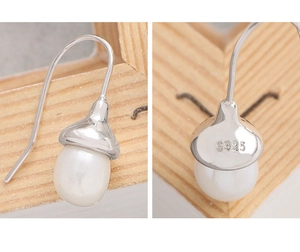 Close-up of S925 sterling silver hallmark on elegant natural pearl drop earring hook