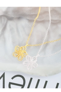 Macro shot of S925 sterling silver stamp on exquisite double-layer hollow flower pendants