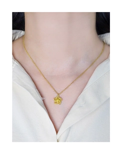 Detailed view of S925 silver double-layer hollow flower necklace on model's neck