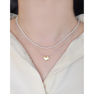Double-layered S925 silver necklace featuring small pearls and a textured lava heart pendant