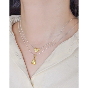 Double layer silver necklace with golden textured lava heart pendants for women