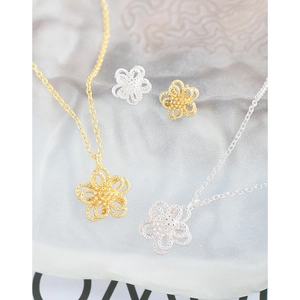 Minimalist double-layer hollow flower necklace and earring set in gold and silver finish