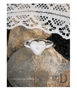 Macro view of S925 sterling silver heart ring with baroque engraving and zircon