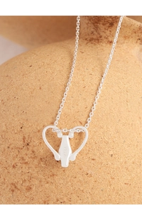 Macro detail of S925 sterling silver heart necklace showing the material stamp and engraving