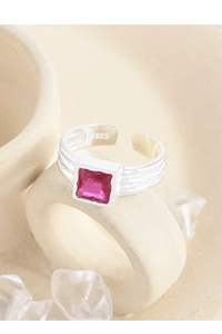 Macro shot of S925 sterling silver ring featuring a square rose pink zircon and textured band