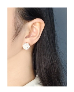 Side view of a woman wearing elegant S925 silver stud earrings with cluster pearl firework ball