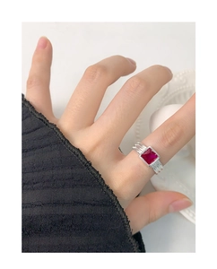 Detailed view of S925 silver ring with textured band and square red zircon gemstone