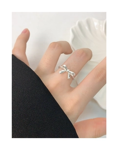 Close-up of S925 silver bow-knot ring on finger with elegant minimalist design