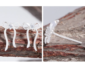 Detail of S925 sterling silver stamp on zircon ribbon bow earrings with a macro view