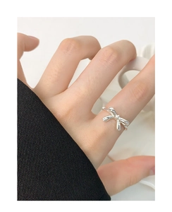 Close-up of S925 sterling silver bow knot ring worn on hand in a lifestyle setting