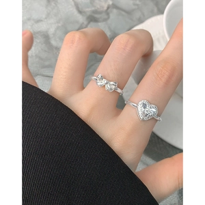 S925 sterling silver ring set featuring a heart relief texture and bow design on fingers