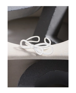 Detail of adjustable S925 silver double-line bow ring with a high-polished mirror finish