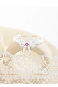 Detail of S925 sterling silver bow ring featuring a pink gemstone and engraved hallmark