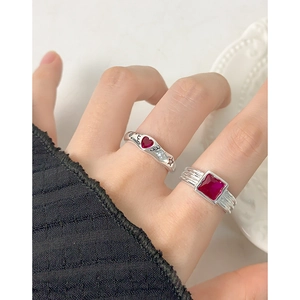 S925 sterling silver rings with rose red zircon heart and square stones on a ceramic plate