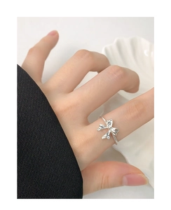 Detailed close-up of S925 silver bow ring featuring realistic fabric-like textures on hand