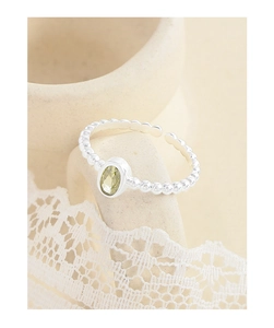 Detailed view of S925 silver ring with oval zircon on a bubble-textured band