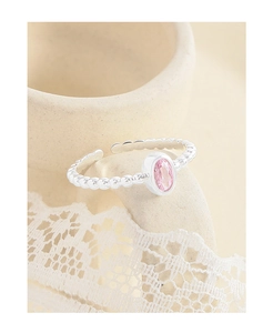 Close-up of S925 silver ring featuring pink oval zircon and beaded texture band