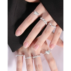 Set of minimalist S925 sterling silver heart and twist rings for elegant layered styling