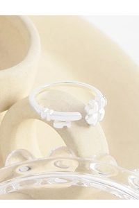 Macro detail of S925 sterling silver open ring with unique key and clover design