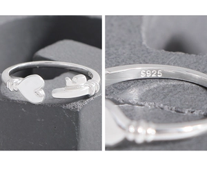 Macro detail of S925 sterling silver ring showing heart key design and purity stamp