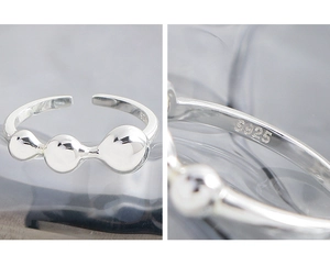 Close-up of S925 sterling silver hallmark on adjustable minimalist ball open ring