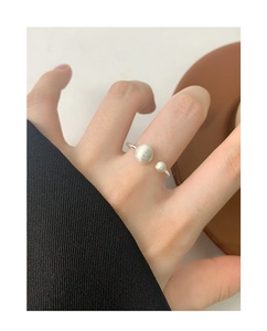 Macro detail of S925 sterling silver open ring with matte brushed double spheres finish