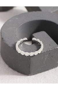 Detailed macro view of S925 sterling silver floral pattern ring with beaded texture