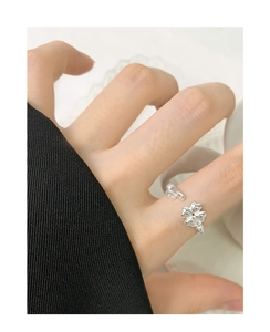 Detailed view of S925 silver open ring featuring clover and key motifs on a hand