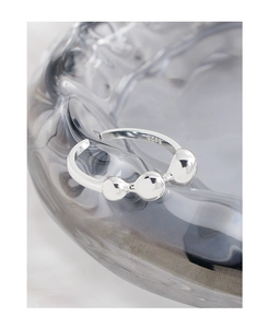 Macro shot of S925 sterling silver stamp on minimalist adjustable ball ring detail