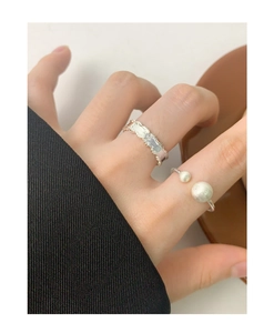 Detail of S925 silver ring featuring matte brushed spheres and twisted rope texture