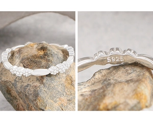 Macro detail of S925 sterling silver stamp on the embossed floral textured ring band