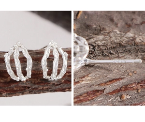 Detailed macro view of S925 sterling silver hallmark on hollow water drop earrings
