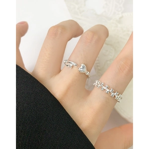 S925 sterling silver ring set with heart and key design on model hand display