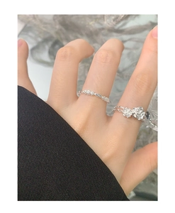 Detailed close-up of a floral S925 silver ring set with delicate rose petal textures